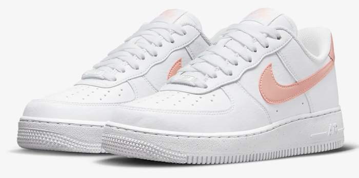 View of white and pink Nike shoes.
